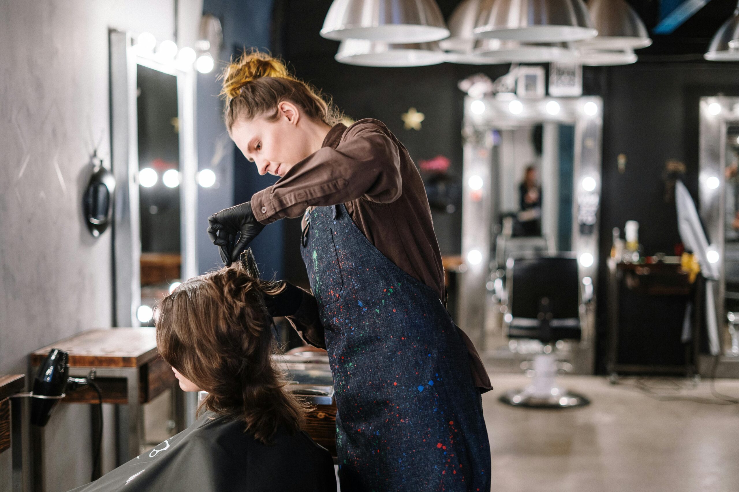 A hair stylist working on her business financed by a Beaty Salon Loan