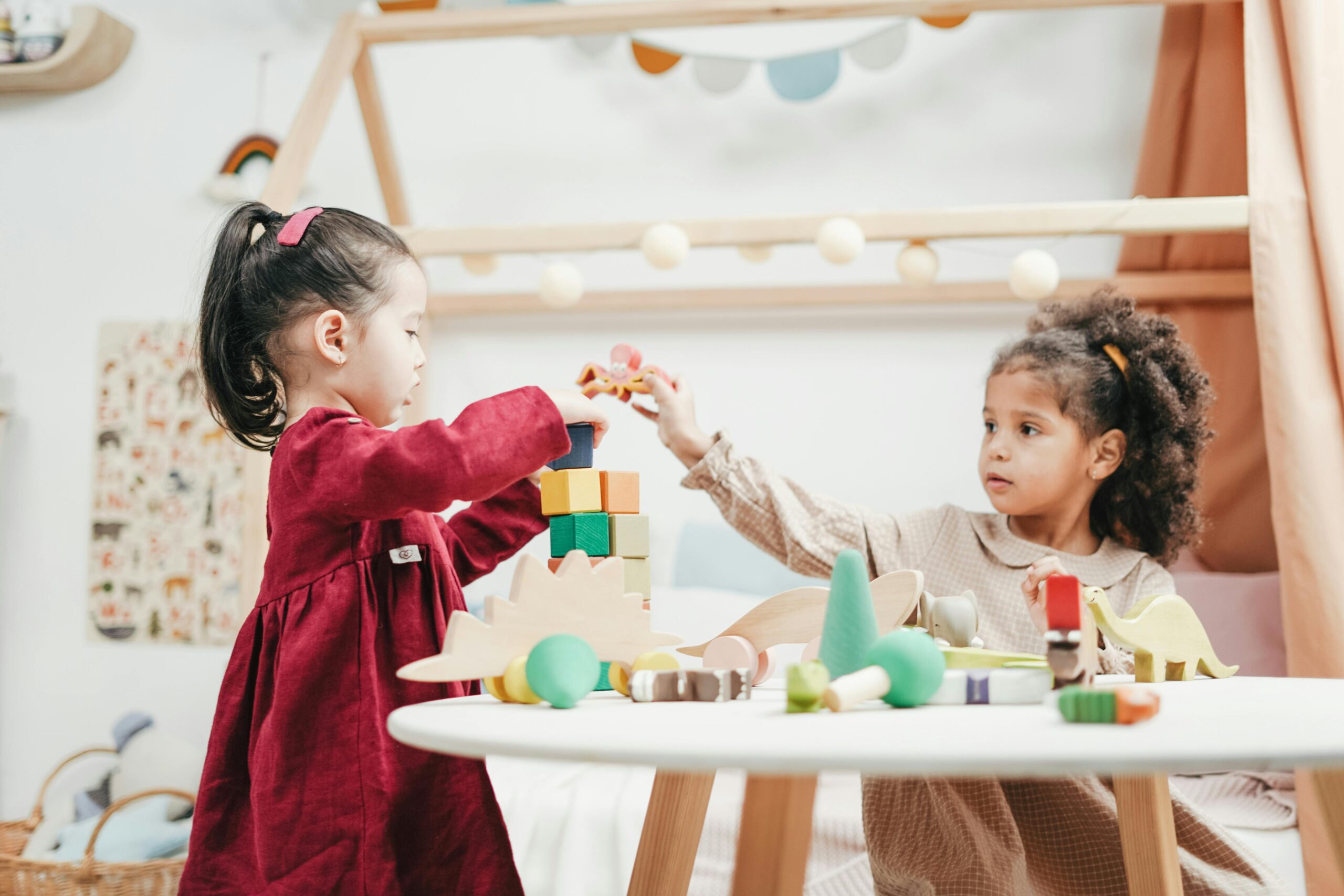 Two girls playing in a Daycare financed with a business loan